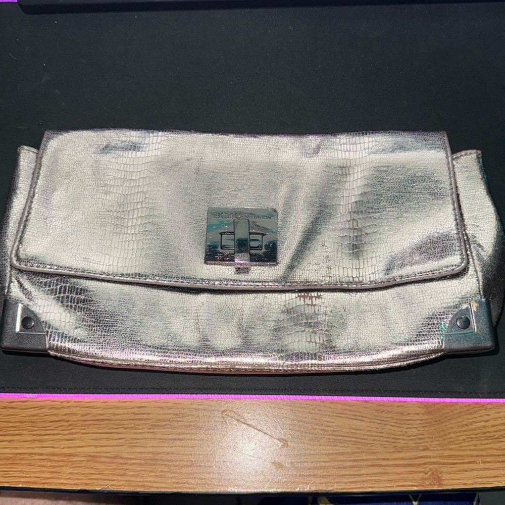 Almosy new just little use but 
missing strap for cross body use (chain)